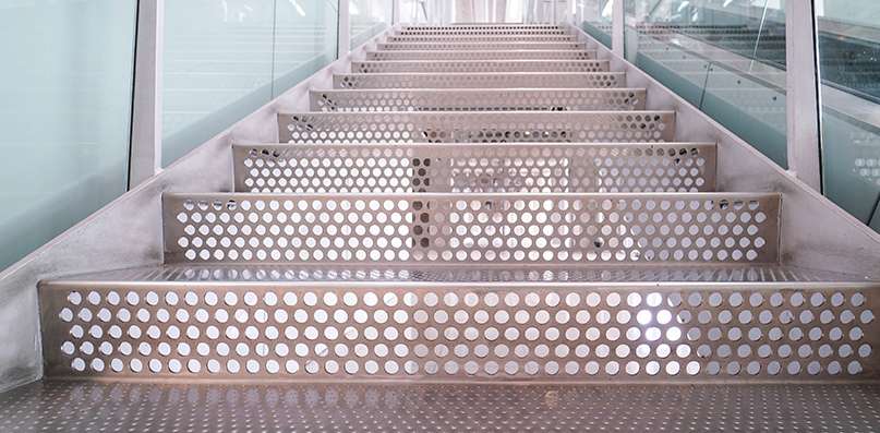 close up of perforated metal stair risers