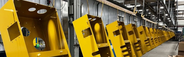 a line of metal enclosures painted yellow