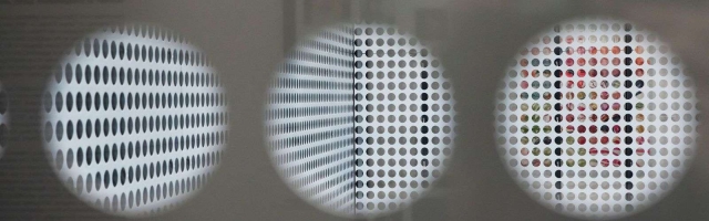 a close up of a circle perforated metal pattern