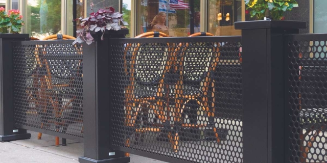 Perforated Metal Fence Outside a Restaurant