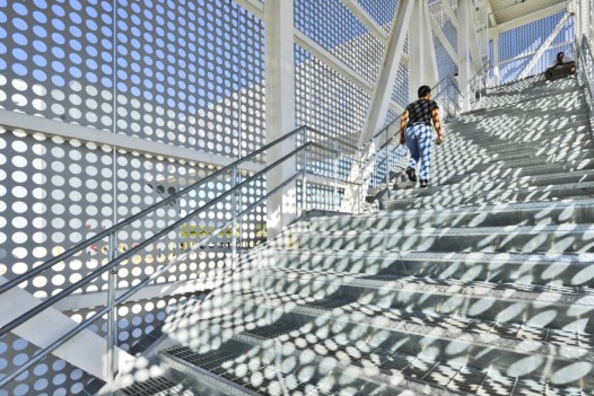 Perforated Metal Shadows On A Staircase