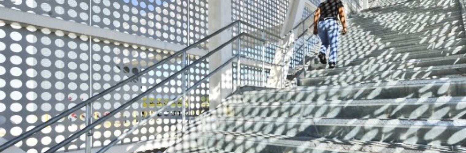 Perforated Metal Shadows On A Staircase