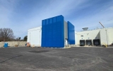 Blue perforated screening on an office building